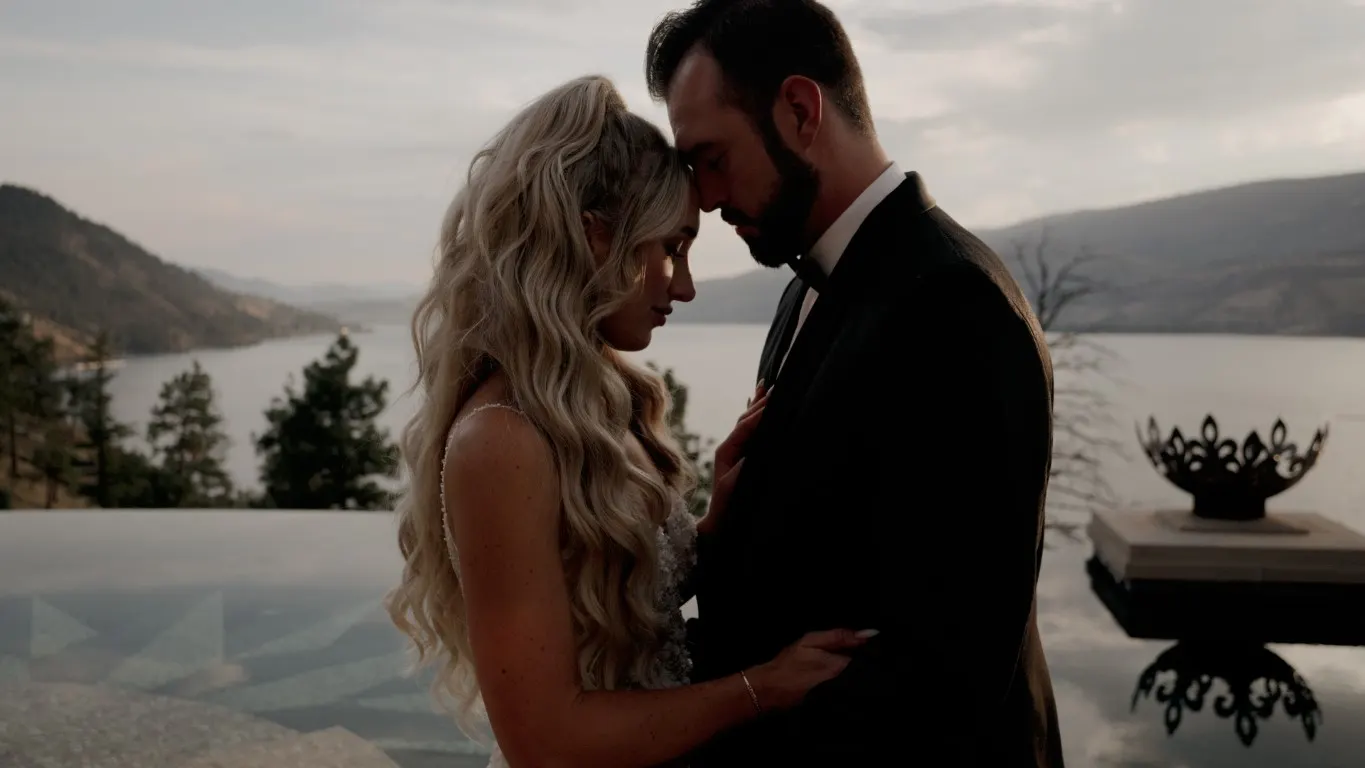 Bride and groom embracing above Okanagan Lake, still from a Pixel Pro wedding film