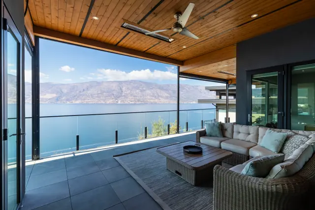Covered patio lake view, lake-view modern home in Lakestone, Lake Country, BC. Real estate photography by Pixel Pro Productions.