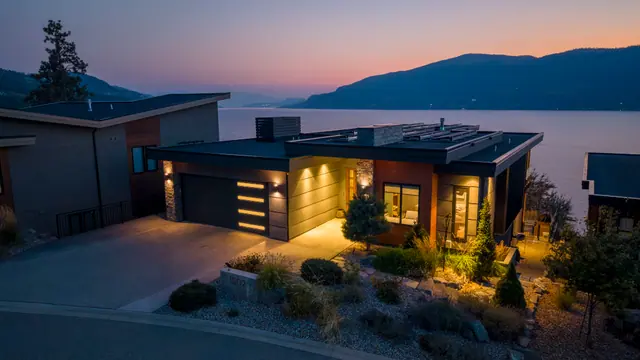 Twilight lake view, lake-view modern home in Lakestone, Lake Country, BC. Real estate photography by Pixel Pro Productions.