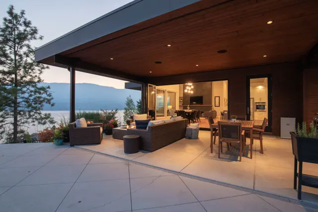 Covered patio twilight, luxury lake-view home in Lakestone, Lake Country, BC. Real estate photography by Pixel Pro Productions.