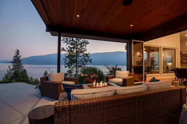 Fire table twilight, luxury lake-view home in Lakestone, Lake Country, BC. Real estate photography by Pixel Pro Productions.