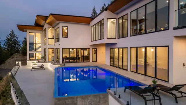 Twilight pool 2, luxury hillside estate in Vernon, BC. Real estate photography by Pixel Pro Productions.