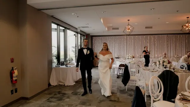 Reception entrance: Nadia & Dean's wedding at Predator Ridge, Vernon. Still from the Pixel Pro wedding film.