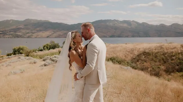 Lake view kiss: Stephanie & Julian's wedding at Sanctuary Gardens, West Kelowna. Still from the Pixel Pro wedding film.