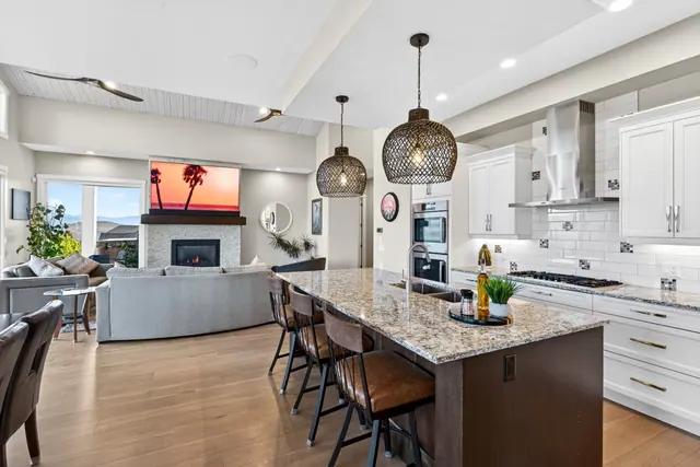 Kitchen living, lake-view family home in West Kelowna, BC. Real estate photography by Pixel Pro Productions.