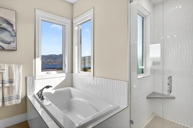 Soaker tub, lake-view family home in West Kelowna, BC. Real estate photography by Pixel Pro Productions.